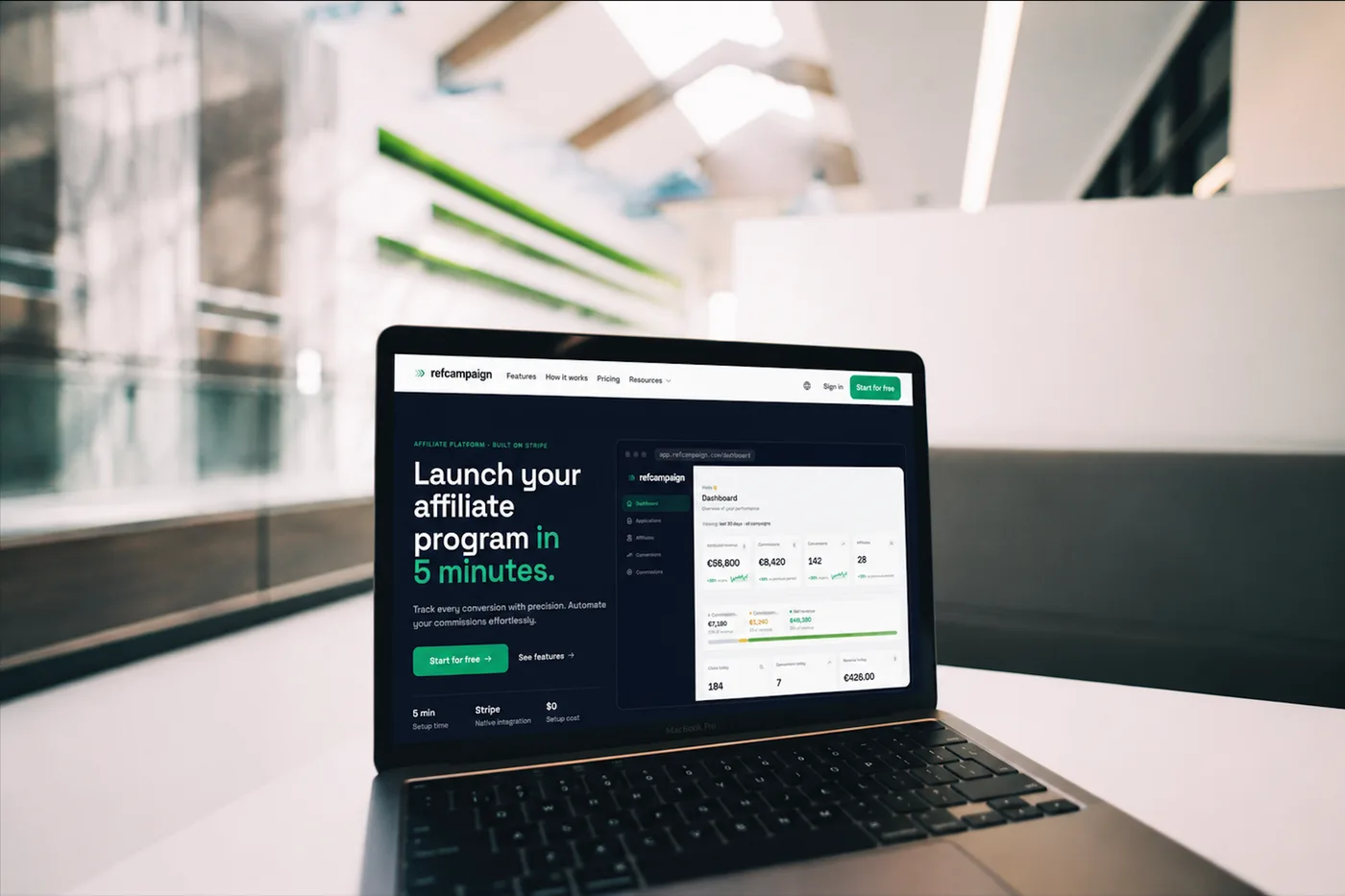 Laptop showing the RefCampaign website and analytics dashboard